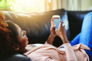 young lady plays with her phone